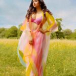 Ritabhari Chakraborty Instagram – “We shall send up a fleet of kites, scrawled with the words of the day.  Kites of bleached muslin stretched over glowing cross-sticks, dressed  with flowing tails. 

They will be seen drifting above the clouds, all our blameless, childish hopes. “

Adding color to your gram in my rainbow hues and @theater.xyz boots 🧡🌸🤍 Puttenham, Bracknell Forest, United Kingdom