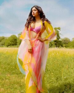 Ritabhari Chakraborty Instagram - “We shall send up a fleet of kites, scrawled with the words of the day.  Kites of bleached muslin stretched over glowing cross-sticks, dressed  with flowing tails. 

They will be seen drifting above the clouds, all our blameless, childish hopes. “

Adding color to your gram in my rainbow hues and @theater.xyz boots 🧡🌸🤍