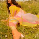 Ritabhari Chakraborty Instagram – “We shall send up a fleet of kites, scrawled with the words of the day.  Kites of bleached muslin stretched over glowing cross-sticks, dressed  with flowing tails. 

They will be seen drifting above the clouds, all our blameless, childish hopes. “

Adding color to your gram in my rainbow hues and @theater.xyz boots 🧡🌸🤍 Puttenham, Bracknell Forest, United Kingdom