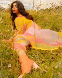 Ritabhari Chakraborty Instagram - “We shall send up a fleet of kites, scrawled with the words of the day.  Kites of bleached muslin stretched over glowing cross-sticks, dressed  with flowing tails. 

They will be seen drifting above the clouds, all our blameless, childish hopes. “

Adding color to your gram in my rainbow hues and @theater.xyz boots 🧡🌸🤍