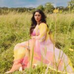 Ritabhari Chakraborty Instagram – “We shall send up a fleet of kites, scrawled with the words of the day.  Kites of bleached muslin stretched over glowing cross-sticks, dressed  with flowing tails. 

They will be seen drifting above the clouds, all our blameless, childish hopes. “

Adding color to your gram in my rainbow hues and @theater.xyz boots 🧡🌸🤍 Puttenham, Bracknell Forest, United Kingdom