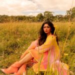 Ritabhari Chakraborty Instagram – “We shall send up a fleet of kites, scrawled with the words of the day.  Kites of bleached muslin stretched over glowing cross-sticks, dressed  with flowing tails. 

They will be seen drifting above the clouds, all our blameless, childish hopes. “

Adding color to your gram in my rainbow hues and @theater.xyz boots 🧡🌸🤍 Puttenham, Bracknell Forest, United Kingdom