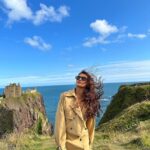 Shakti Mohan Instagram - Castling winds 🏰🌬️ 📸 @alishasingh.official Styled by @camy1411 Wearing @madaboutfashion_kejal Jewellery @azotiique Dunnottar Castle