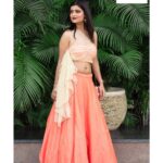 Sharvary Joshi Instagram - #Repost @houseofarchana (@get_repost) ・・・ Gorgeous Actress @sharvaryjoshi Slaying in our peach barfi silk chaniya with Kundan work motif & draped one sided blouse from our Pocket Friendly Festive Wedding collection 2020. Peach zardosi embroidered clutch from @archanasfashionhouse Contact 8469077744 to buy it. Designed by @archana.makwana In frame:- @sharvaryjoshi Photography by @_a.vphotography_ Jewellery courtesy @skgoldjewels Mua @zeba_khan_vohra for @the_face_studio_vadodara Venue courtesy @shaktigreens #weddingfestive2020 #weddingcollection2020 #houseofarchana #archanasfashionhouse #vadodarafashiondesigner #designeroutfits #drapedblouse #indowesternwear #stylishindianoutfits #indianweddingwear #festivecollection2020 #trends2020 #fashiontrends2020