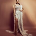 Shehnaaz Kaur Gill Instagram - 🤍🤍🤍🤍 Outfit by : @yascoutureworld @eliemadi Heels by : @publicdesire Styled by : @manekaharisinghani Styling Assts - @chintan_shah08 x @tunushkaa Makeup : @sonicsmakeup Hair : @cheemabaljit2 Shot by : @priyankknandwana
