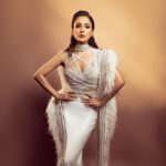 Shehnaaz Kaur Gill Instagram - 🤍🤍🤍🤍 Outfit by : @yascoutureworld @eliemadi Heels by : @publicdesire Styled by : @manekaharisinghani Styling Assts - @chintan_shah08 x @tunushkaa Makeup : @sonicsmakeup Hair : @cheemabaljit2 Shot by : @priyankknandwana