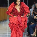 Shehnaaz Kaur Gill Instagram - Red Hot🔥 @shehnaazgill wore a ravishing red taffeta dress with oversized hand-embroidered blooms, dripping with crystals and sequins by #abujanisandeepkhosla at the opening of the Jio World Plaza. @jioworldplaza #abujanisandeepkhosla #shehnaazgill #jioworldplaza #MumbaiAtThePlaza #Shinewithstyle #ExperiencethePlaza #fashionpresentation #opening #fashion #style #classic #goldenage #signaturestyles #abujani #sandeepkhosla