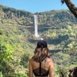 Aakriti Rana Instagram - Three hours away from Pune, there is a beautiful three layered waterfall in Satara. There is a beautiful little trek towards the Vajrai Waterfall and I am sure you will fall in love with it. Isn’t Maharashtra so beautiful. Tell me your favourite waterfall 😀 Tag your friends! ❤️ #aakritirana #aakritiandrohan #waterfall #vajrai #vajraiwaterfall #india #maharashtra #travelblogger #indiantravelblogger #dronephotography #reelsinstagram