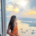 Aakriti Rana Instagram - Are you a Batman fan too? There are so many stunning shots of Hong Kong in the Dark Knight. The tower in the poster is the IFC tower which can be seen along with the gorgeous view of the city from Sky100 observatory. It’s on the 100th floor of the ICC tower which is the tallest building in Hong Kong. The second part was shot at the Largest Escalator System in the world! Hong Kong has hilly terrain and this unusual mode of transportation helps to cover a long distance which would require several miles of zigzagging if travelling by car.This escalator system was featured on the CNN website as one of the “coolest commutes” in the world in March 2015 @sky100hk @discoverhongkong Outfit: Blue Dress (Zara) Orange maxi (@julyissue_online) #aakritirana #DiscoverHongKong #HelloHongKong #batman #partnership #thedarkknight #travel #travelblogger #indiantravelblogger #hongkong