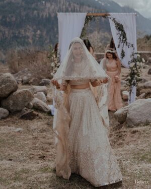 Aakriti Rana Instagram - #AakritiGetsAnchored 🥰
Under the beautiful open blue sky, amidst the mountains, surrounded by our friends and family, I walked with my brightest smile towards the moment we dreamed about together. 

Photography: @believecollective 
Our Outfits: @abhinavmishra_ 
Jewellery: @paisleypopshop 
Makeup and hair: @priyankaguptamakeupartist 

#aakritiandrohan #wedding #manali #happilyeverafter #mountainwedding #indianwedding #weddingphotography