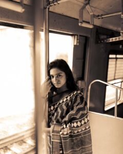 Akshatha Ajit Instagram - She sat by the window, lost in a novel, the rhythmic motion of the air gazing her auburn hair. She was able to feel the whispering sound of the untold stories in the journey, each glance revealed a universe of emotions.The train, an anthology of fleeting moments, carried its cargo of dreams and realities. The Train Tales… to it’s destination. . 📸 @hariz_comrade 🤍