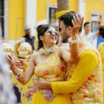 Amruta Deshmukh Instagram – Our future so bright 🌞 You gotta need shades 😎 
#HaldiScenes #Yellowजीसनमहमआगये 
Thank you @designer_kazbee for the brightest Haldi outfits!
•
📸 @surajpatel.in 
MUA: @swatighodke_mua_official 
Styled by: @tanmay_jangam 
Floral jewellery by: @floralart_byanushka Nature Fun Resort