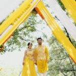 Amruta Deshmukh Instagram – Our future so bright 🌞 You gotta need shades 😎 
#HaldiScenes #Yellowजीसनमहमआगये 
Thank you @designer_kazbee for the brightest Haldi outfits!
•
📸 @surajpatel.in 
MUA: @swatighodke_mua_official 
Styled by: @tanmay_jangam 
Floral jewellery by: @floralart_byanushka Nature Fun Resort