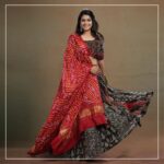 Ananthika Sanilkumar Instagram - The charming @ananthika_sanilkumar appears in our magnum opus. This Ajrakh Kalamkari blouse is a splendid creation, featuring intricate patch detailing at the waistline and delicate embroidery at the bust area. The small patches of Ajrakh and Bandhani makes them more elegant. The hand embroidery detailing inspired from "KINSUGI", the famous Japanese craft/ art of repairing broken pottery magnifies the charm of the outfit The Kalamkari panel skirt continues the theme with patch detailing at the waistline and panels, creating a cohesive look. The Red Bandhani modal silk dupatta is the perfect finishing touch, with its tissue pallu adding a touch of elegance. This ensemble is a true work of art and is sure to turn heads wherever it is worn. Get the look #byhand #byhandin #KalamkariBlouse #EthnicWear #Handmade #SustainableFashion #BlockPrint #TraditionalWear #Bandhani #KINSUGI #ModalSilk #ModalFabric #ananthikasanilkumar