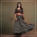 Ananthika Sanilkumar Instagram – The charming  @ananthika_sanilkumar appears in our magnum opus.

This Ajrakh Kalamkari blouse is a splendid creation, featuring intricate patch detailing at the waistline and delicate embroidery at the bust area. The small patches of Ajrakh and Bandhani makes them more elegant. The hand embroidery detailing inspired from “KINSUGI”, the famous Japanese craft/ art of repairing broken pottery magnifies the charm of the outfit  The Kalamkari panel skirt continues the theme with patch detailing at the waistline and panels, creating a cohesive look. The Red Bandhani modal silk dupatta is the perfect finishing touch, with its tissue pallu adding a touch of elegance. This ensemble is a true work of art and is sure to turn heads wherever it is worn.

Get the look

#byhand #byhandin #KalamkariBlouse #EthnicWear #Handmade #SustainableFashion #BlockPrint #TraditionalWear #Bandhani #KINSUGI #ModalSilk #ModalFabric #ananthikasanilkumar