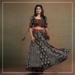 Ananthika Sanilkumar Instagram - The charming @ananthika_sanilkumar appears in our magnum opus. This Ajrakh Kalamkari blouse is a splendid creation, featuring intricate patch detailing at the waistline and delicate embroidery at the bust area. The small patches of Ajrakh and Bandhani makes them more elegant. The hand embroidery detailing inspired from "KINSUGI", the famous Japanese craft/ art of repairing broken pottery magnifies the charm of the outfit The Kalamkari panel skirt continues the theme with patch detailing at the waistline and panels, creating a cohesive look. The Red Bandhani modal silk dupatta is the perfect finishing touch, with its tissue pallu adding a touch of elegance. This ensemble is a true work of art and is sure to turn heads wherever it is worn. Get the look #byhand #byhandin #KalamkariBlouse #EthnicWear #Handmade #SustainableFashion #BlockPrint #TraditionalWear #Bandhani #KINSUGI #ModalSilk #ModalFabric #ananthikasanilkumar