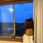 Anusha Dandekar Instagram - Will forever be my favourite window and view… 🪟 ❤️ with the sticker I never bothered removing as I got older and the curtains I never changed, even though they weren’t me but mum had got them from India, so I painted my room purple instead to go with it hehe… no one liked that but I loved it! Oh & the big purple stain on the carpet is still there coz of my terrible painting skills.. 🧑‍🎨 They had to repaint my room coz they couldn’t sell it with that color 💜🥹 I’ll miss coming home… to you. 💔