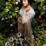 Ayesha Zeenath Instagram - An ethereal sari in earthen grey embellished with Studio149’s signature details in hand embroidery crafted by our skilled craftsmen to create this stunning piece of sheer elegance featuring @aysha7__official Shot by @georgesimon_m Mua @renuka_mua Jewelry @rimliboutique Outfit & styling @studio149 #receptionsari #tullesari #cocktailsari