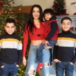 Celina Jaitly Instagram - The new year is upon us and as a family we are committed to thoughts and prayers only of peace, safety and security of children stricken by conflict. This year we also did only one present each on #christmas in order to continue our endeavours in supporting children going through heartbreaking times. As a family we remain committed to the causes of children caught in conflict. Our combined prayers are for a 2024 devoid of war. We pray for peace and a safe year for children. On a lighter note please do note our Christmas alter includes a dinosaur paying homage with #santaclaus to the Christmas tree 😁 ( mantle piece decor) baby @arthurjhaag feels #dinosaurs must be included in all family celebrations. #photographer : @haag.peter 🧿✨ @winstonjhaag @viraajjhaag @arthurjhaag #happynewyear #celinajaitly #celinajaitley #bollywood #missindia #missuniverso #peaceandlove #🧿 #internationalfamily #austrian #indian