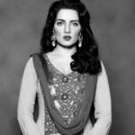 Celina Jaitly Instagram - Of whom does this image remind you ? I have always believed black and white films change a movie thematically, providing atmosphere, tone, and visually providing stark contrasts and a dreamlike view of the world…. just like this photograph, I see a Celina in this image who belongs in a story from an era gone by, a story which is yet to be told. I hope to do a film which brings out the true depths within me as a performer just like SEASONS GREETINGS- A TRIBUTE TO RITUPARNO GHOSH two years ago. A period film is on my list of desires, I am ready for it now I have all the shades that are needed for a film like that, life taught me those depths of black, white and greys !! 🩶🖤🤍 #celinajaitly #celinajaitley #indianactress #bollywood #blacknwhitephotography #missindia #missuniverso