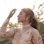 Deepika Venkatachalam Instagram - #Weddinglookbook Rajasthani themed Sangeeth (1/3) 🫶🏼✨ We knew sangeeth would be full of fun and laughter with our close friends & family hence theme was set to Rajasthani for their vibe and joy. From the moment the theme was chosen, the quest for the perfect outfit began for me and Raja, because we were so excited for the Sangeeth to be precise. We wanted an outfit that spoke bling, sophistication and elegance. Our talented stylist @stylingbysamiha created a mood board with neutral shades and a sequin combination. The colours beige, brown and peach were shortlisted and finally, we chose the colour beige because that went well for both of our skin tones. And to add the bling, Samiha suggested going for sequins and net fabric. That was it. Colour and fabrics were fixed. Woooh 😁🔥 When we were looking for a lot of designers @mayon_by_subhathracouture came across and we loved their works. From the moment we stepped into their store to the moment our outfits were delivered, they listened to every need and made sure we got what we wanted. The team gave us a lot of design options to choose and customize from and when the final design was shown, I fell in love instantly. Imagine a doll-like sequin-layered net gown - the top half adorned with glittering sequins that shine like stars, while the flattering netted bottom with twirl-worthy flares that add a touch of magic to every spin. Who will not fall in love with this beauty la?🙈 😍 A bling outfit without perfect accessories is a No right?! Samiha chose a super cute and simple white stoned choker set from @fineshinejewels with a small earring and a ring. It added more elegance to the outfit and at the same time didn't steal the attention from the outfits as well. And on the day, when I was completely ready I felt like a Barbie doll myself ready to dance my heart out and have fun at our Sangeeth. 🙈 So what does my #instafam think? Do I look like a bling Indian barbie doll?😌 . 📸 @sakshi.ramakrishnan Decor @vizhamedai Makeup and hair : @snehamnj . #RnD #RnDwedding