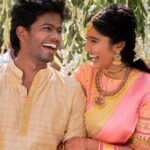 Deepika Venkatachalam Instagram – #Weddinglookbook 
Kerala themed Engagement (5/5) 💕✨

After that breathtaking lehenga, it was time to change for “Ring Exchange” 💍 and we had no heart to change the mood board and color palette for the second outfit! But wanted a quick changeover and went for this pleasantly beautiful gold saree that had a blush pink border adorned with motifs of the tree of life from @muhurth.brand ❤️ We looked into 50+ sarees from multiple brands but my heart said “Go for this”  RVP approved too! 🫶🏼

The saree by itself was a beauty and just to add some grace to it we went on to experiment with blouse designs. That’s exactly when @d.sign.d came in and gave us a lot of ideas & finally our choice was this blouse with intricate embroidery that added a hint of simplicity, sophistication and tradition to the overall look❤️

Nextuhhhh….Jewelsuhh😌

Our pro stylist @artra_styling suggested to go for a bright temple look jewelery with bright red stones and emeralds to amp up the saree and I abided by it only to find the perfectly looking set from @vriksham that definitely added the touch of gorgeousness. ✨

Oh yes, for my groom! 🫶🏼 Raja wanted the changeover for the ring exchange to be simple. He preferred a “Veshti” and our stylish gave us the choice of pairing it with a Kurta in the same golden shade. 

As always, his silk veshti and his silk fabric for the kurta were picked from Nalli! 

We took it all to our Malar Akka @fiorebymalar_ and she made the kurta that looked so good on him! 🥺🫶🏼 
Like I said he wanted minimal dress up and just went ahead with his chain and bracelet only! 

I must admit it all fell in place so beautifully for both of us and we got lucky to figure out the finest people around us to ensure everything fell in place and our day was indeed filled with love and love only! 🫶🏼💕
.
📸 @photonimage_by_daran 
Decor @tharunam.in 
Jewellery @vriksham 
Saree @muhurth.brand 
Blouse @d.sign.d 
Styling @artra_styling 
Makeup @kabooki_mua 
.
#RnD #RnDwedding