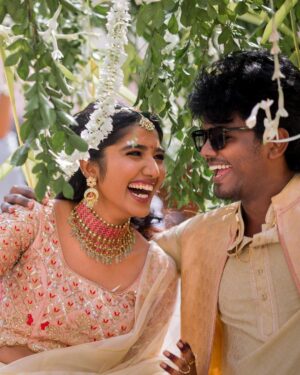 Deepika Venkatachalam Instagram - #Weddinglookbook A kerala themed - Engagement 💕 (2/5)

The moment we decided to have our Engagement depicting Kerala, we were sure to have our outfits reflecting their culture in a unique way that would speak D & RVP. 
Stylist pavi @artra1210 to our rescue and she quickly narrowed down to the mood boards of Ravivarman paintings.

That was it! 

The next morning we found ourselves at @nallisilksarees since it is an emotion in Chennai, a brand that is known for hand woven silks with the authenticity and quality. 
I think all of us would have brought something from Nalli during our childhood. La ? 🥹

Shopping for fabrics was so joyful & in no time our eyes fell on a pure hand-woven brocade silk fabric. I turned towards for her approval and she came up with something so thoughtful. She said we can use this same fabric for my lehenga and Raja's jacket. 🫶🏼 I fell for it! ❤️

Next up was scouting a fabric for my top and we found a beautiful pink! 

Our forever favourite @fiorebymalar_  worked along with our Pavi for days together for this outfit that I dreamt myself in everyday until the big day. It was a sure head turner for me as well when I had the first look at the whole outfit. Don't you feel the same? 🥰 

While Raja wanted his outfit to be subtle & minimal we went on shop a nice Kurta set from @myntra and paired it along with the jacket designed by Pavi (@artra1210 ) and made by Malar akka. ( @fiorebymalar_ )

My jewellery from @rimliboutique and Raja's shoes from @lifestylestores added some more charm to the whole ensemble!! 

The whole outfit planning went on for days before it became a reality and we cannot be more proud about our stylist & designer for giving us these fairytale kinda looks 🤍

More to come from our close to heart happy Kerala themed engagement that showered white and enormous love!🤍🫶🏼
.

📸 @photonimage_by_daran 
Decor @tharunam.in 
Makeup & hair : @kabooki_mua 
.

[ Check the YT link ( in my bio) to watch the engagement film ]
.
#RnD #RnDwedding