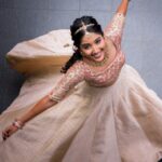 Deepika Venkatachalam Instagram – #WeddingLookBook ( Engagement : 1/4 )

Your D is back with a styling series again, and this time, it’s for our #RnDwedding. Ah Still feels surreal :”)🧿

The first outfit I wore for this special occasion was nothing short of magical. It was a breathtaking lehenga with a panelled skirt and a stunning hand-embroidered crop top. My stylist @artra1210 wanted it to be both traditional and modern, so I can reuse it forever 😅 . @fiorebymalar_ Akka spent days working on the crop top and made sure it looked royal as well. 🥹 Everyone loved how the top and skirt complemented each other and blended with the Kerala theme.

But ena dhan plan panaaalum., konjam sodhapum la .. 😅 Long story short- I missed my dupatta. (Watch our engagement film on YouTube to know what happened later then. Dupatta vechi Oru kutty promotion.hehe) 

As it was getting late for the ceremony, @artra1210 instantly got an idea to snatch a dupatta from one of my bridesmaids. 😂 And she legit styled it in a way it matched my whole outfit! -(This is why you need a wedding stylist brooo ❤️)
 “Ponnu naa dhan but naa potruka dupatta endhu ila“ 😂

We wanted both pieces of the outfit to be staple pieces so that they could be styled in different ways in the future and still look like a complete outfit even without the dupatta & I think we achieved the goal.

For the jewellery styling, we were initially confused. But, the pro @artra1210 was so confident and decided to go for jewels that matched the crop top’s colour. The beautiful outfit became even more stunning with the matching choker, head Tikka, and bangles from @rimliboutique ❤️

The outfit, makeup by @kabooki_mua , jewellery by @rimliboutique and decor by @tharunam.in came together beautifully, and with the vibrant smiles of our friends and family, it felt like a royal engagement. My then-fiancé and now-husband approved of my look at first glance and made me feel like a royal princess on our engagement day. So, does my #instafam approve of it? Let us know in the comments! 🌝
.
📸 @photonimage_by_daran 
.
#RnDwedding #Engagement