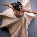Deepika Venkatachalam Instagram – #WeddingLookBook ( Engagement : 1/4 )

Your D is back with a styling series again, and this time, it’s for our #RnDwedding. Ah Still feels surreal :”)🧿

The first outfit I wore for this special occasion was nothing short of magical. It was a breathtaking lehenga with a panelled skirt and a stunning hand-embroidered crop top. My stylist @artra1210 wanted it to be both traditional and modern, so I can reuse it forever 😅 . @fiorebymalar_ Akka spent days working on the crop top and made sure it looked royal as well. 🥹 Everyone loved how the top and skirt complemented each other and blended with the Kerala theme.

But ena dhan plan panaaalum., konjam sodhapum la .. 😅 Long story short- I missed my dupatta. (Watch our engagement film on YouTube to know what happened later then. Dupatta vechi Oru kutty promotion.hehe) 

As it was getting late for the ceremony, @artra1210 instantly got an idea to snatch a dupatta from one of my bridesmaids. 😂 And she legit styled it in a way it matched my whole outfit! -(This is why you need a wedding stylist brooo ❤️)
 “Ponnu naa dhan but naa potruka dupatta endhu ila“ 😂

We wanted both pieces of the outfit to be staple pieces so that they could be styled in different ways in the future and still look like a complete outfit even without the dupatta & I think we achieved the goal.

For the jewellery styling, we were initially confused. But, the pro @artra1210 was so confident and decided to go for jewels that matched the crop top’s colour. The beautiful outfit became even more stunning with the matching choker, head Tikka, and bangles from @rimliboutique ❤️

The outfit, makeup by @kabooki_mua , jewellery by @rimliboutique and decor by @tharunam.in came together beautifully, and with the vibrant smiles of our friends and family, it felt like a royal engagement. My then-fiancé and now-husband approved of my look at first glance and made me feel like a royal princess on our engagement day. So, does my #instafam approve of it? Let us know in the comments! 🌝
.
📸 @photonimage_by_daran 
.
#RnDwedding #Engagement