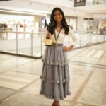 Deepika Venkatachalam Instagram – Your D is back again with a styling dress up game. OG’s remember our #littlegame we used to do a few years back ?🥹

For our 4th award event, I wanted to try something new and ordered an outfit online, but unfortunately, I didn’t receive it until 2 hours before the event. So I decided to go for styling an outfit myself with the basic knowledge and with the help of pinterest. I wanted to go for a saree or maxi dress. But pinterest had other ideas. Hehe. Right when I opened the app, it popped up a ruffle skirt outfit on the feed. 

That’s when I remembered having a ruffle skirt myself, ( from @kanthadesignstdo ) that I sourced for Abi for season 1, but couldn’t use it. So I decided to go for it with a fitted white crisp shirt, that I used a couple of times for brand shoots. ( White shirts are an absolute staple piece in our wardrobe, because it can be styled in ‘n’  number of ways- take notes ) Over the years you’ve seen me style a white shirt in many ways paired with maxi skirts, cargo pants, different types of jeans, palazzo and formal pants.
I loved how this particular skirt and the shirt went well together, but with the 3 layered chain it seemed complete!❤️ ( and ofc with the medal and the award, it looked beyond perfect 🧿 ) 

I was nervous about the look since I styled it for an event. But right from the moment I stepped out of my room, everyone right from mom, dad, and people at the event complimented and approved the look. ( light ah proud feels 🌝 because it’s been ages since I styled myself ) 
What do my #instafam think of this look? Do you guys approve it?🥺
.
Details : 
Shirt @hm 
Skirt @kanthadesignstdo 
Layered chain @westsidestores 
Shoes @metroshoesindia 
.
📸 @keshu_hariharan 
.
#deepika #styling