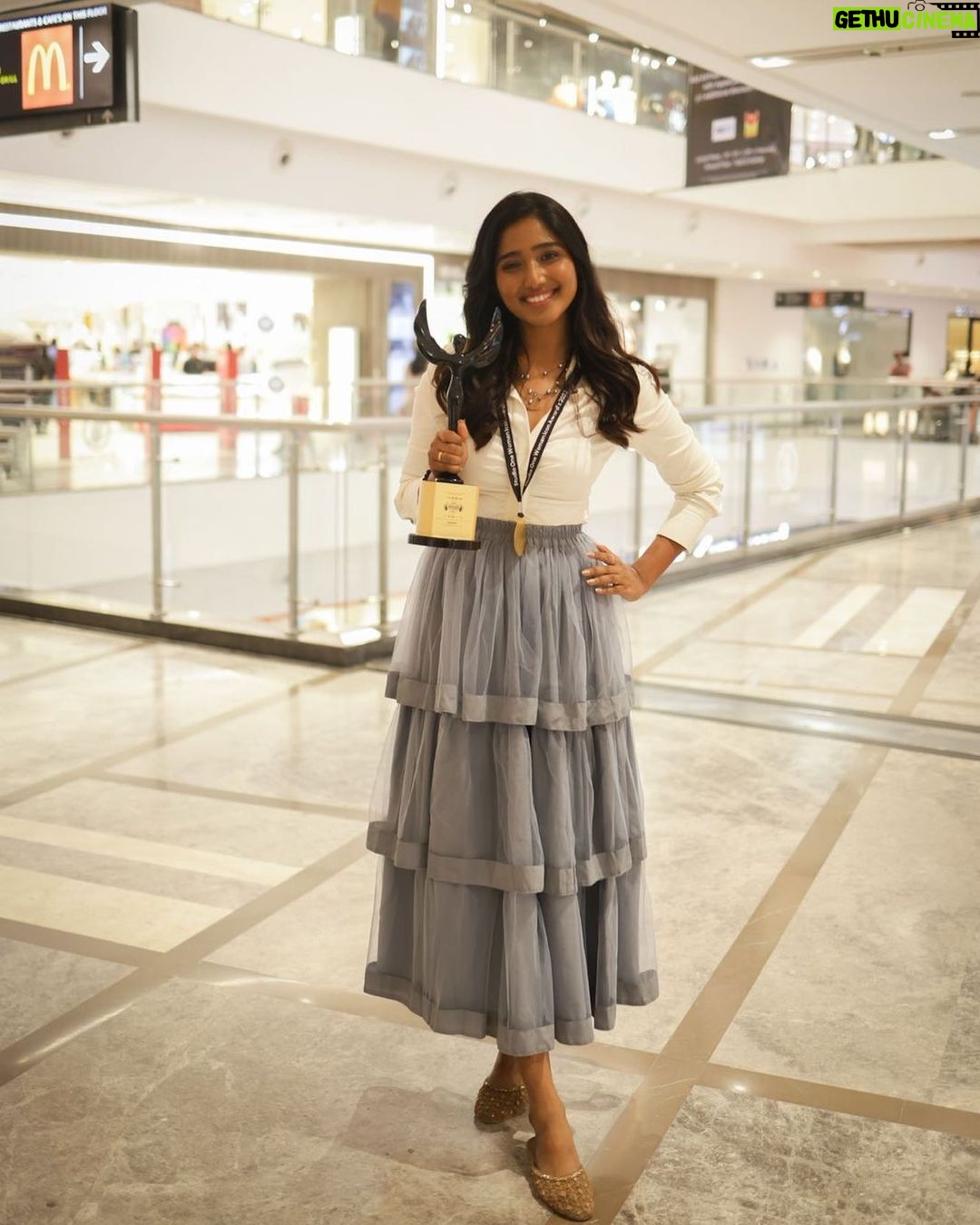 Deepika Venkatachalam Instagram - Your D is back again with a styling dress up game. OG's remember our #littlegame we used to do a few years back ?🥹 For our 4th award event, I wanted to try something new and ordered an outfit online, but unfortunately, I didn't receive it until 2 hours before the event. So I decided to go for styling an outfit myself with the basic knowledge and with the help of pinterest. I wanted to go for a saree or maxi dress. But pinterest had other ideas. Hehe. Right when I opened the app, it popped up a ruffle skirt outfit on the feed. That's when I remembered having a ruffle skirt myself, ( from @kanthadesignstdo ) that I sourced for Abi for season 1, but couldn't use it. So I decided to go for it with a fitted white crisp shirt, that I used a couple of times for brand shoots. ( White shirts are an absolute staple piece in our wardrobe, because it can be styled in 'n' number of ways- take notes ) Over the years you've seen me style a white shirt in many ways paired with maxi skirts, cargo pants, different types of jeans, palazzo and formal pants. I loved how this particular skirt and the shirt went well together, but with the 3 layered chain it seemed complete!❤️ ( and ofc with the medal and the award, it looked beyond perfect 🧿 ) I was nervous about the look since I styled it for an event. But right from the moment I stepped out of my room, everyone right from mom, dad, and people at the event complimented and approved the look. ( light ah proud feels 🌝 because it’s been ages since I styled myself ) What do my #instafam think of this look? Do you guys approve it?🥺 . Details : Shirt @hm Skirt @kanthadesignstdo Layered chain @westsidestores Shoes @metroshoesindia . 📸 @keshu_hariharan . #deepika #styling
