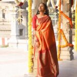 Deepika Venkatachalam Instagram - A combo of elegance and authenticity ft. @aaranyasilks ♥️ There's something always so special about kancheevaram sarees in our native colours la? Like Dhanush in yaardi nee mohini says, Red'uh nga! Red'uh thaan super ah irukum. It makes you feel like a family punch lamp (kudumba kuthu vellaku) 🙈🤣 One such saree is this maroon & orange combo one. While the pallu and border took the majority of maroon, the vibrant orange in the body part steals everyone's attention in the crowd. It's a pure handloom silk saree with pure gold zari, which gives you a royal look effortlessly. The body has the special velthaari zari checks(woven in hands) with thread motifs along with the traditional kanjivaram koravai borders. ( swipe left to have a closer look to the details) If you're someone who is looking for a simple yet classy kancheevaram saree, then this is a perfect fit for you. And guess what?! Their silk sarees price starts from just 6k and its a great steal for this wedding season. Deeii all you bride to be and brides maids, take notes olunga. Hehehe😌 Next...coming to the styling, we opted to style this saree with a plain blouse matching to the saree border, with a stack of contrast bangles, a gold jumkha and left the neck empty, to give the wide border the full credits to its beauty❤️ Special credits to @stitchhousesalem for stitching the blouse so fit and exactly the way I wanted. What do you think about it? And lemme know how you girls would style this saree in the comments below💭 . 📸 @kanmaniphotography Dolled up by @chisellemakeupandhair ( who happened to be my stylist as well 😂 ) and @saisubha_hairstylist . #deepika #chennaiblogger #chennaiinfluencer #styling #saree #bridalsarees