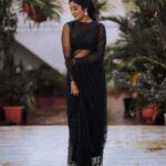 Deepika Venkatachalam Instagram – Black Saree – A Timeless Classic🖤 ft @bespoke.dhishya ✨

The moment I came to know that we were nominated for the She Awards, I knew I should look great on the day, no matter if we won the black lady or not. The first person I called was Pavi @artra_styling , (she was the one who did our engagement styling) and when I told her about the award nominations she was more excited than us and was in full swing to make me look my best on our big day. 

Pavi suggested a black saree look to keep the simple and ethnic girl-next-door vibe ON and to match the aesthetic of the award- the black lady. We were searching for a lot of options and the one look that grabbed our attention in an instant and made us head over heels in love was this black sequin saree from  @bespoke.dhishya 🖤 It looked perfect for an award show and I’m sure I’d restyle it for my cousin’s or friend’s reception too. ( Receptions and Black! Hehe. 🙈 iykyk) For the blouse we decided to go classic with full sleeves and a boat neck and team @d.sign.d were sweet enough to do it in the last minute for us with full embroidery and perfectly delivered it in no time. 101 reasons why I go back to them, again and again ✅

To keep the attention on the saree, Pavi suggested only a white stoned flower motif designed ring and earring from @aaranyarentaljewellery and it was just perfect! 💎

We wanted to keep the makeup & hairdo minimum and @athmika_makeupstories  gave a subtle look just like how I wanted and @priyaprabu_artistry did a super cute ponytail that elevated the whole look beautifully. When I stepped out of my room all dolled up, Amma was so stunned looking at me and loved the whole look. Enna thaan veliya 1000 peru sonnalum, Amma solra “Azhagaa irukaa dii” is always special laa?🥹

We quickaahh went to the terrace and clicked some beautiful pictures before we went to the event. And that night we were back home with the Black Lady on our hands. Always grateful for that night and the love I received 🖤

But now looking at the pictures makes me think this would be a classy look for a Diwali evening party. 🔥 #DiwaliwithD (8/10) What say guys?🌝
.
📸 @mukesh__dm 
.
#deepika #diwaliwithD #chennaiinfluencer