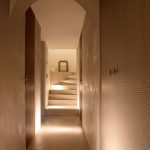 Diipa Khosla Instagram - Revealing one of my favourites rooms - The “atelier”, beautifully coined by our incredible architect @gabriela.puig.soleille whose vision was to create a world of zen and tranquility for our subterranean haven. Why I love it so much? The arched ceilings, the elegant materials, and the magic of invisible doors make this space truly one-of-a-kind. Project realised by “Gabriela Soleille Studio“ @Gabriela.puig.soleille Architect collaborator: Carole Martinod @carole.inraw Creative Director: Mirko Musmeci @mirko.musmeci Door Veneer: Alpi @alpi_wood in Day & Night Twill Door Fixtures & Handles: Formani @formani_doorware From the EV series in satin gold Wall Paint: Detale @detalecph in KC14 Microcement: La Nena @lanenahome Lights: Viabizzuno @viabizzunoprrogettiamolaluce Spotlights: M1 Micro Scomparsa Totale & Microtraccia Micromen Atelier: PP P1 Parete, NP N55 Parete Con Braccio Antiques & Chandigarh Chairs: Mayur Arts @mayurartsindia, Antique Statues Vintage Furniture: Atelier Uma @atelieruma Photographed by @ankeleunissenphotography