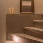 Diipa Khosla Instagram - Revealing one of my favourites rooms - The “atelier”, beautifully coined by our incredible architect @gabriela.puig.soleille whose vision was to create a world of zen and tranquility for our subterranean haven. Why I love it so much? The arched ceilings, the elegant materials, and the magic of invisible doors make this space truly one-of-a-kind. Project realised by “Gabriela Soleille Studio“ @Gabriela.puig.soleille Architect collaborator: Carole Martinod @carole.inraw Creative Director: Mirko Musmeci @mirko.musmeci Door Veneer: Alpi @alpi_wood in Day & Night Twill Door Fixtures & Handles: Formani @formani_doorware From the EV series in satin gold Wall Paint: Detale @detalecph in KC14 Microcement: La Nena @lanenahome Lights: Viabizzuno @viabizzunoprrogettiamolaluce Spotlights: M1 Micro Scomparsa Totale & Microtraccia Micromen Atelier: PP P1 Parete, NP N55 Parete Con Braccio Antiques & Chandigarh Chairs: Mayur Arts @mayurartsindia, Antique Statues Vintage Furniture: Atelier Uma @atelieruma Photographed by @ankeleunissenphotography