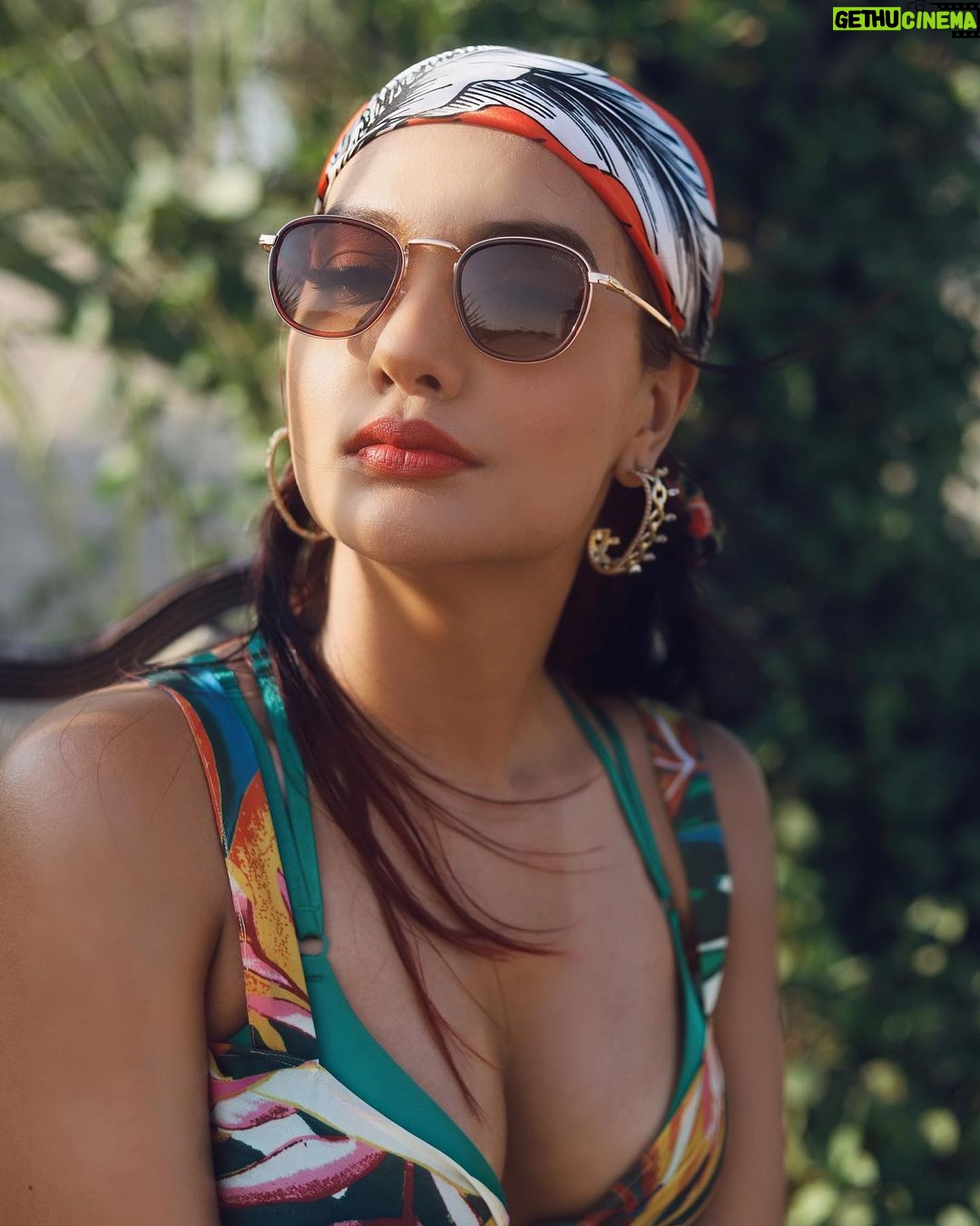 Divya Agarwal Instagram - I’m feeling so exotic . Cape @iamkenferns Cord set @erotissch_ Style by @stylingbyvictor @sohail__mughal___ Makeup @dishisanghvii Earrings @sianofficial_ Shades @opiumeyewear Footwear @tic_tac_toe_store Hair @fouzikazi_makeupndhair Clicked by @deepaksfilmography . . #divyaagarwal #vibecheck #tropical #fashiongram #workmode