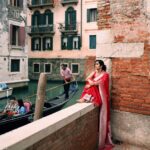 Divya Vadthya Instagram - “Venice” you are a beauty! Had the best food , loved eating the gelato , my morning coffees and the night wines … beautiful streets and bridges , great walks in this traditional saree … wow such an amazing vacation Tq beautiful for capturing me @vicky_photo.it ❤️ Love my red saree @srikrishnasilk 🥰