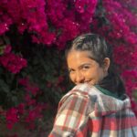 Mamitha Baiju Instagram - Lush, Wild & So full of colours... She is a bougainvillea!💗 . PC: @arsha_baiju (paranju idipichath..still i have doubts🤨😂) #throwback#dubai