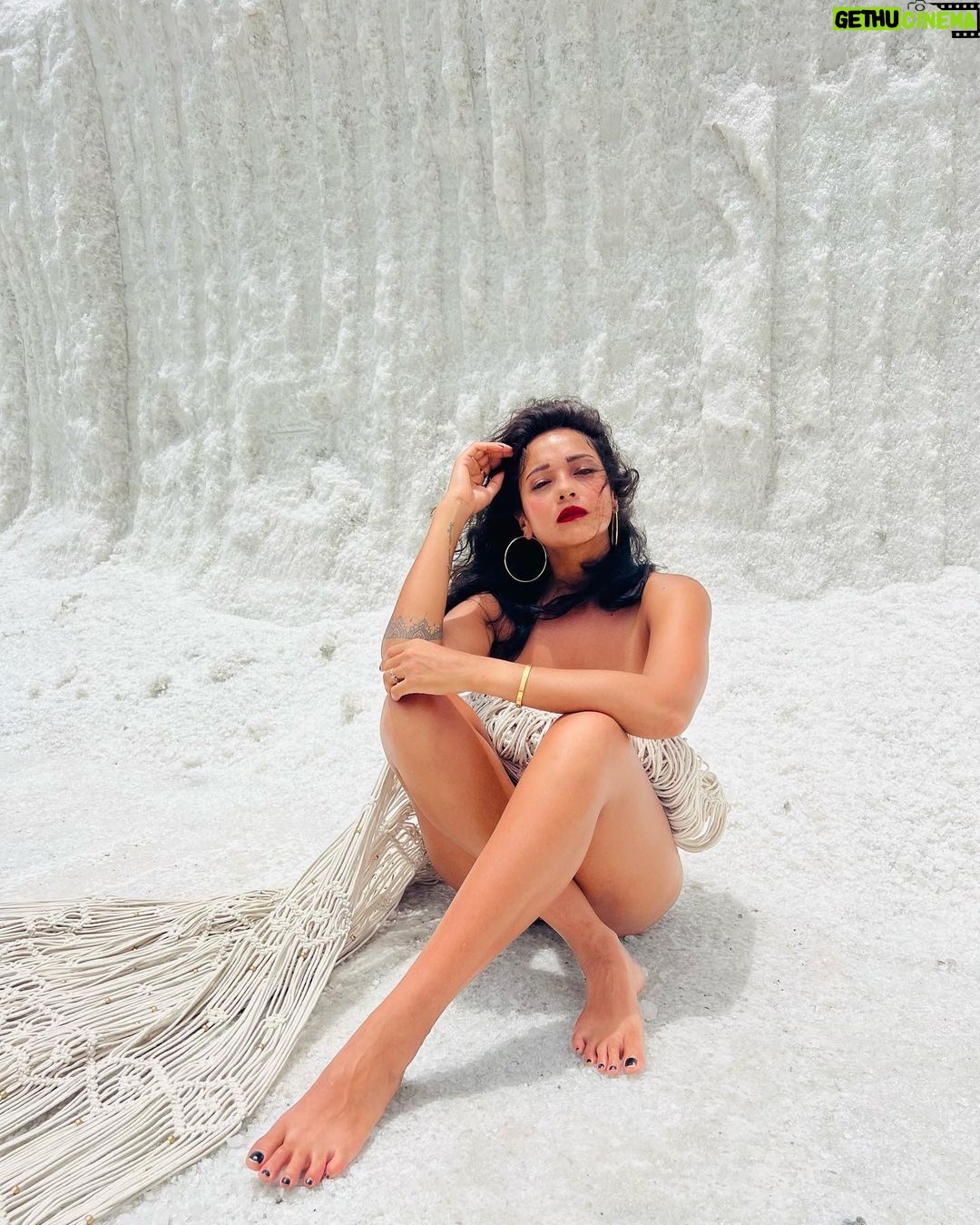 Megha Gupta Instagram - There is something strangely sacred about salt. Our sweat, tears, the sea, are all made up of salt. In the Bible, salt also came to symbolize purity, perfection, wisdom, hospitality, durability, and fidelity. I use salt for a physical and spiritual cleanse regularly. It repels evil spirits and absorbs any negative energy from a space. In this case, symbolises purification, protection, loyalty, and permanence. Salt is power. It might sound like alchemy, but the energy in places where salty ocean water and freshwater mingle could provide a massive source of renewable power. I recently discovered that I’m SALT (Single And Loving It), another version of “salt” these days 😂🤲🏻 I love when I find myself at the right place at the right time and presented myself with an opportunity where I visited Las Salinas in Cabo Rojo in Puerto Rico. Completely unplanned, turned the car around and had this adventure and I’m thankful for everything and everyone that played a part in this 🙏🏼 I’m engulfed in Indian Macarame and raw raw vast expanse of tones and tones of salt. It was hot, I couldn’t open my eyes with the Sun burning down on the gleaming white salt. The salt was burning but I felt this sacred energy in the air. Of the salt, the silence which was loud and reassuring, and immense peace. By doing just this, I consider my time in The USA a success. “Salt of the Earth” - Always. #salt #caborojo #puertorico #usa #centralamerica #carribbean #travel #salt #sacredsalt #macarame #red #white #summer #ootd #tan #traveller #meghagupta Cabo Rojo, Puerto Rico
