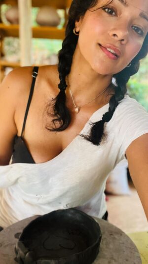 Megha Gupta Instagram - Playing with Earth Mothers most primal element. 
Shaping it but letting it shape me. 
Making a bowl to hold my nourishment but it’s actually the emptiness within that holds value. 
For some, it’s dirt.. for most, it’s clay. 
Dirt.. clay.. it really has nothing to prove. 

Years ago, when I lived in Bby, i drove down to Pune in the rains and did a 7 day workshop of pottery on the wheel. 9 am to nearly 7 pm, I sat at the wheel playing with clay, making friends with it, with beautiful rains coming down all around me and hot tea to give me company. 

There is something so absolutely beautiful about working with your hands and your own energy, specially in the rains, that hours pass by and you don’t reach for your phone or think a thought that isn’t needed to be thought. 

As the weekend rolls in, I hope you find the motivation in this content to spend some time doing what really grounds you. 

#weekend #goa #monsoon #clay #workshop #pottery #wheelpottery #welllbeing #art #hobby #talent #notneeded