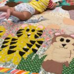 Mohena Singh Instagram - नमस्ते दुनिया, मैं अयांश सिंह रावत । 🌸 I’m 4 months old and I can finally see and enjoy colours , shapes , touch and sound so well. This is how I enjoy my tummy time. On my beautiful animal quilt that मॉं just took out for me. Thank you so much to all the wonderful mothers at @purkalstreeshakti for making this “oh so fun” quilt for me, with my name on it. ये बहुत ही प्यारी है । आप सभी को बहुत सारा प्यार, आपका, Ayaansh 🐯