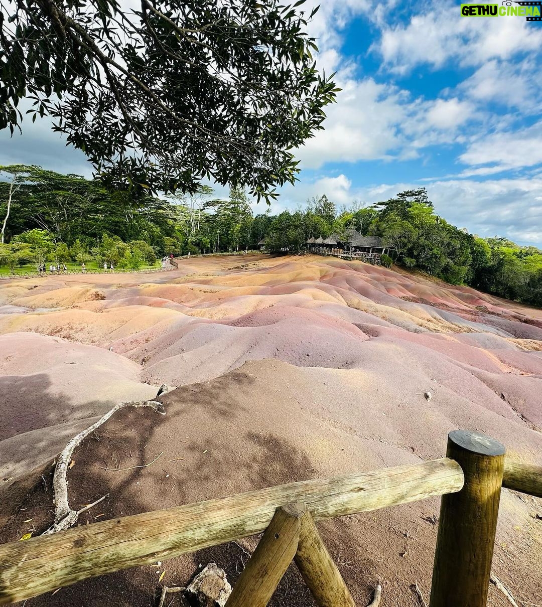 Niharika Dash Instagram - The Seven Coloured Earths refer to a natural phenomenon in Chamarel, Mauritius, where the sand dunes display seven distinct colors, ranging from red, brown, violet, blue, green, to yellow. This unique geological feature is a popular tourist attraction due to the striking and vibrant hues created by the mineral content of the sand. ❤️ Chamarel 7 Coloured Earth Geopark, Mauritius