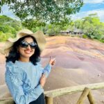 Niharika Dash Instagram - The Seven Coloured Earths refer to a natural phenomenon in Chamarel, Mauritius, where the sand dunes display seven distinct colors, ranging from red, brown, violet, blue, green, to yellow. This unique geological feature is a popular tourist attraction due to the striking and vibrant hues created by the mineral content of the sand. ❤️ Chamarel 7 Coloured Earth Geopark, Mauritius