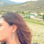 Richa Chadha Instagram - Once upon a time in Bhutan… #TravelTuesday…with @mayank0491 @whimsicalfantasy … wanna go back ! ❣️🫶🏽🤌🏽one of my best trips till date. 2nd last video features us trying to get an image in a river bed! Last video features Khandu, our driver and pal, who was the most fun companion.