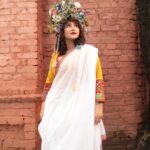 Swastika Mukherjee Instagram - Recreating one of Mashi’s saree borders on a dhuti - simple white as the Sarat Ritu clouds and a thin paar with Aam Kolka and Flowers. Dhuti in the length of a saree so that it can be worn as both. @swastikamukherjee13 looks straight out of a Greek fantasy world in our blouse and her mother’s saree recreated in Tant. Styled by @rishabhad Managed by @lipstickler Photographer: @upaharbiswas Make up: @prosenjit4867 Hair : @mallicknita.bigbi Location : Courtesy @ranit.maiti Kolkata