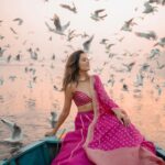 Aakriti Rana Instagram - Before you ask, lag rahi thi thand mujhe 🤣 But fashun is important 📍Yamuna Ghat, Delhi Have you ever been here, visit before all the birds leave. The sunrise here is absolutely breathtaking with thousands of birds flying around. P.s they feed them namkeen there to fly around the boat 🙊 Jitna bada namkeen ka packet, utne zyada birds around your boat. Outfit : @kalkifashion 📸. @shivam.vashisht @shivamphotoworks #aakritirana #yamunaghat #yamunaghatdelhi #sunrise #collab #photography #fashion #lehenga #indianwear #travelblogger #sunrisephotography #dreamy #delhi