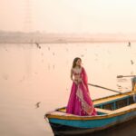 Aakriti Rana Instagram - Before you ask, lag rahi thi thand mujhe 🤣 But fashun is important 📍Yamuna Ghat, Delhi Have you ever been here, visit before all the birds leave. The sunrise here is absolutely breathtaking with thousands of birds flying around. P.s they feed them namkeen there to fly around the boat 🙊 Jitna bada namkeen ka packet, utne zyada birds around your boat. Outfit : @kalkifashion 📸. @shivam.vashisht @shivamphotoworks #aakritirana #yamunaghat #yamunaghatdelhi #sunrise #collab #photography #fashion #lehenga #indianwear #travelblogger #sunrisephotography #dreamy #delhi