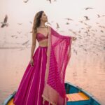 Aakriti Rana Instagram - Before you ask, lag rahi thi thand mujhe 🤣 But fashun is important 📍Yamuna Ghat, Delhi Have you ever been here, visit before all the birds leave. The sunrise here is absolutely breathtaking with thousands of birds flying around. P.s they feed them namkeen there to fly around the boat 🙊 Jitna bada namkeen ka packet, utne zyada birds around your boat. Outfit : @kalkifashion 📸. @shivam.vashisht @shivamphotoworks #aakritirana #yamunaghat #yamunaghatdelhi #sunrise #collab #photography #fashion #lehenga #indianwear #travelblogger #sunrisephotography #dreamy #delhi