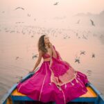Aakriti Rana Instagram - Before you ask, lag rahi thi thand mujhe 🤣 But fashun is important 📍Yamuna Ghat, Delhi Have you ever been here, visit before all the birds leave. The sunrise here is absolutely breathtaking with thousands of birds flying around. P.s they feed them namkeen there to fly around the boat 🙊 Jitna bada namkeen ka packet, utne zyada birds around your boat. Outfit : @kalkifashion 📸. @shivam.vashisht @shivamphotoworks #aakritirana #yamunaghat #yamunaghatdelhi #sunrise #collab #photography #fashion #lehenga #indianwear #travelblogger #sunrisephotography #dreamy #delhi