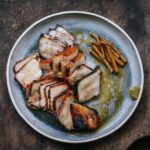 Adam Liaw Instagram - Tonight’s dinner. Misozuke grilled pork belly with yuzu kosho and pickled burdock. Pork belly cured for a day in brown rice miso and ginger, the roasted slowly on the barbecue for about half an hour